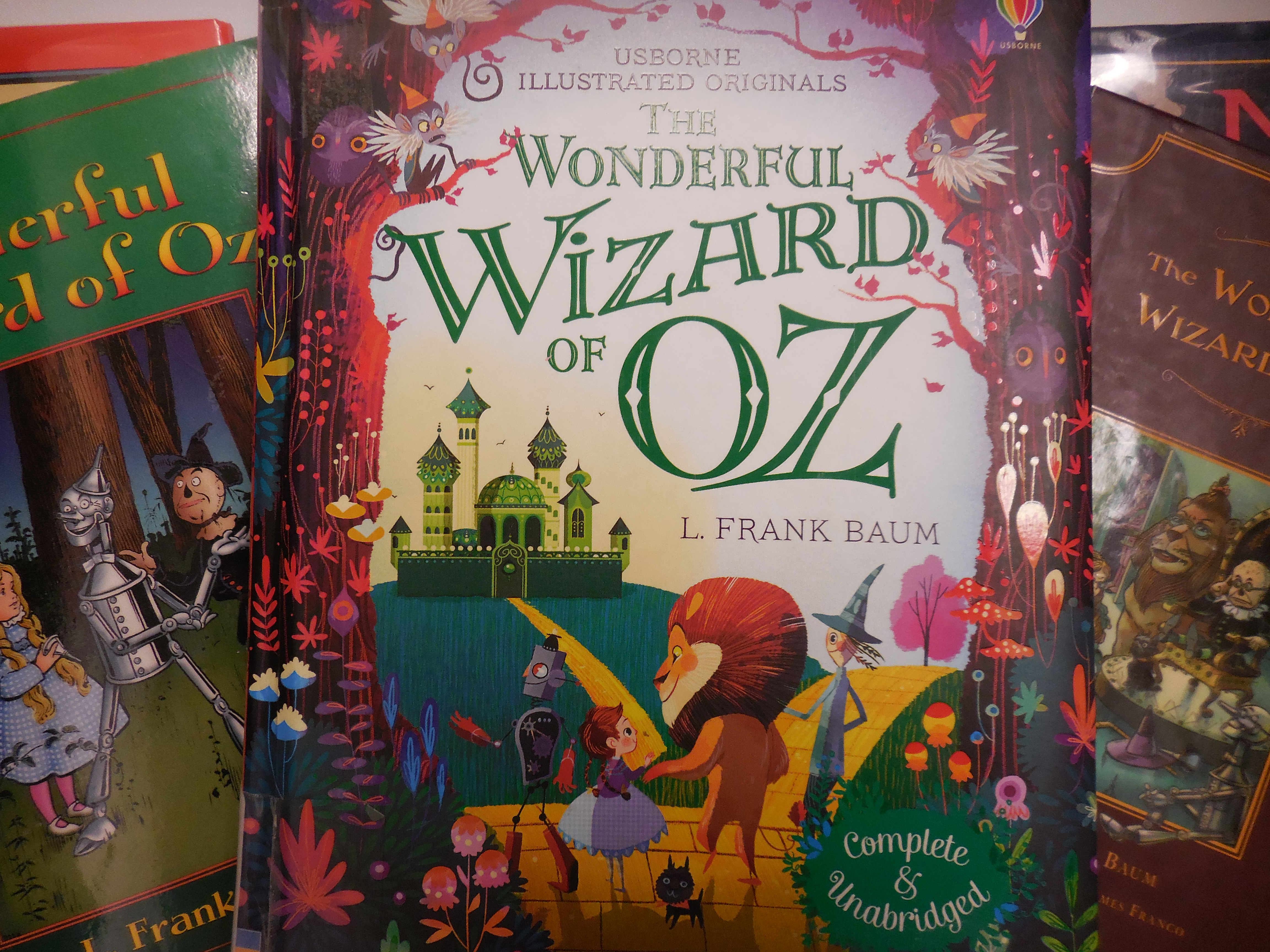 multiple copies of The Wonderful Wizard of Oz book