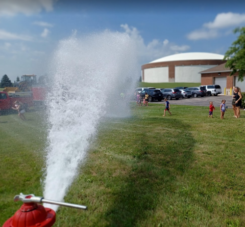 open fire hydrant with children